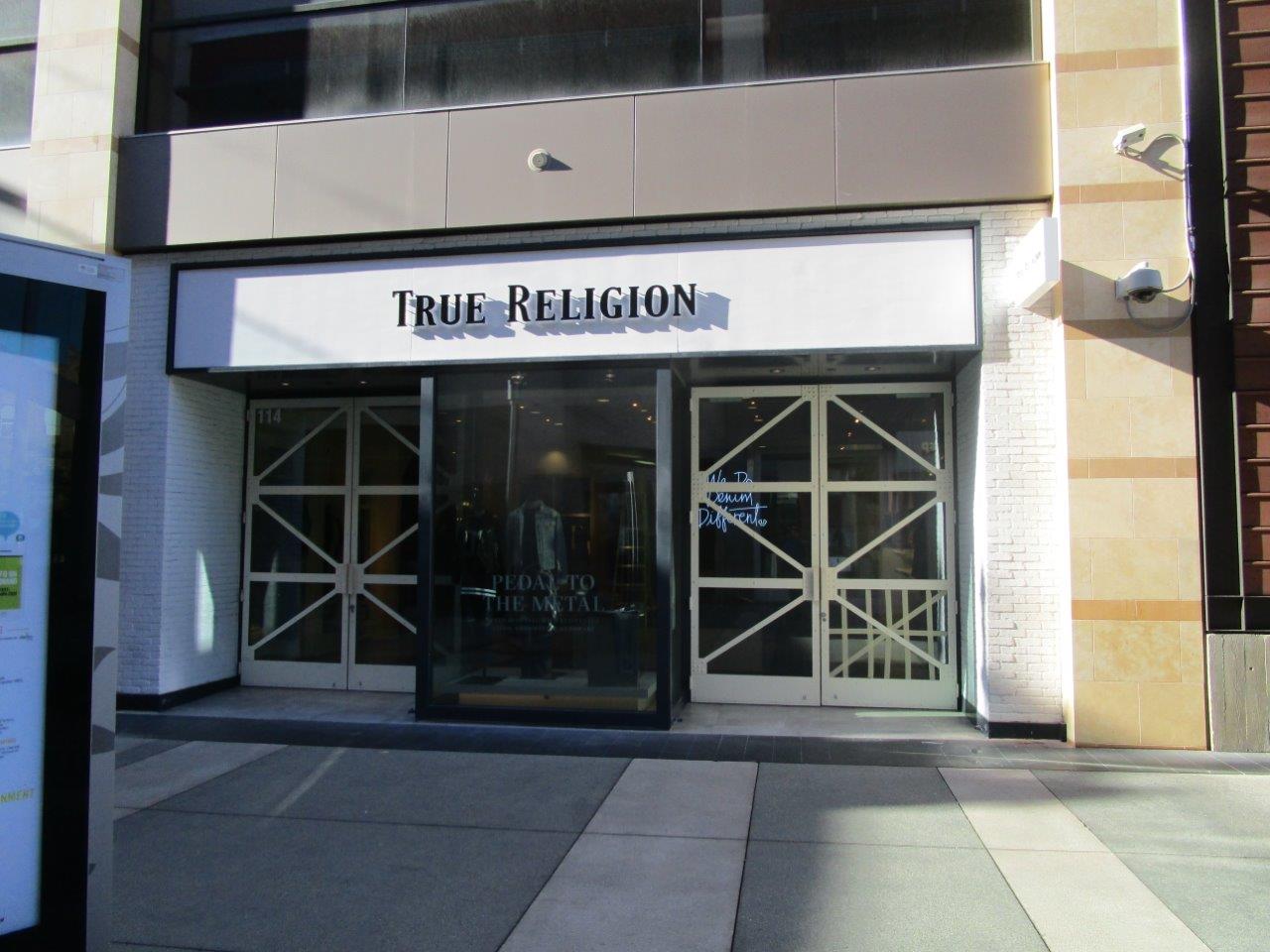 Example of specialty sign installation by NGS Films and Graphics at True Religion.