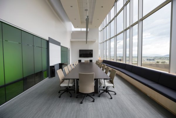 Large conference room with lots of natural light and frosted privacy window film on the left side