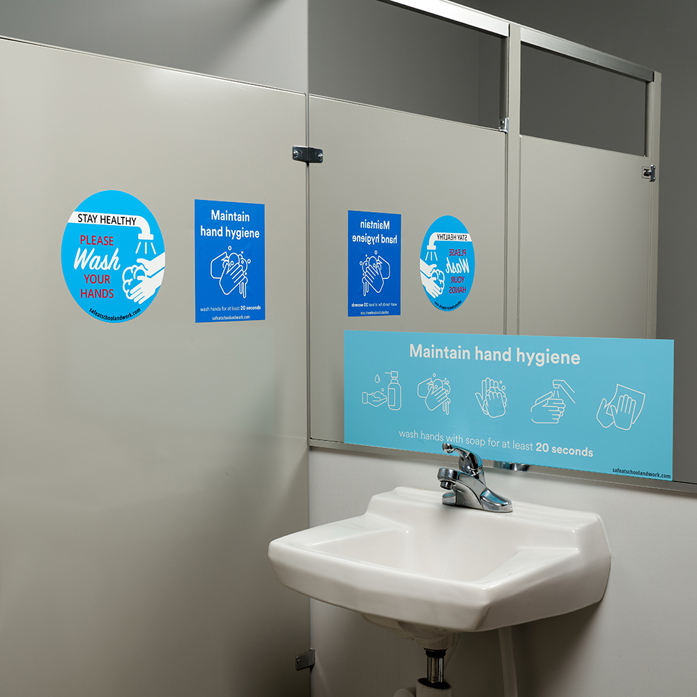 Hand washing graphics made by NGS in place in a bathroom.