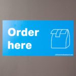Order Here graphic on wall