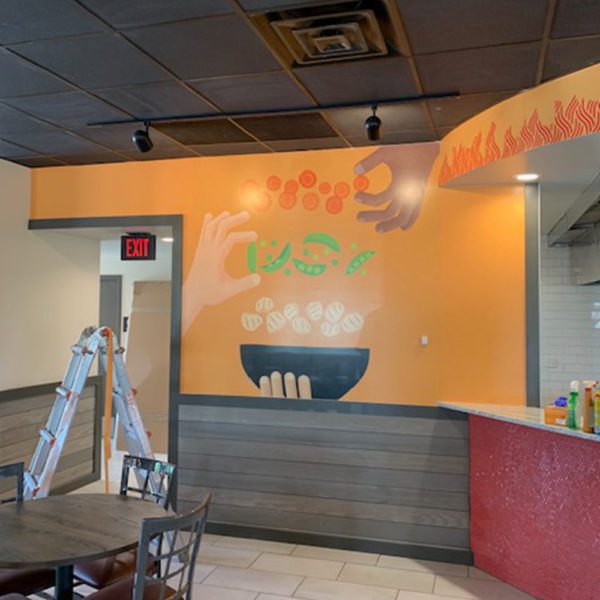 NGS graphics installed on a wall inside a Mongolian grill.