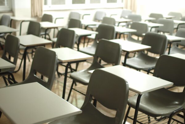 A classroom with chairs in a school with security window film installed with state funding